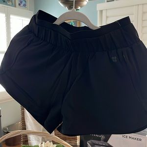 Sweaty Betty, 4 inch running shorts with sweat, wicking material, two and one.